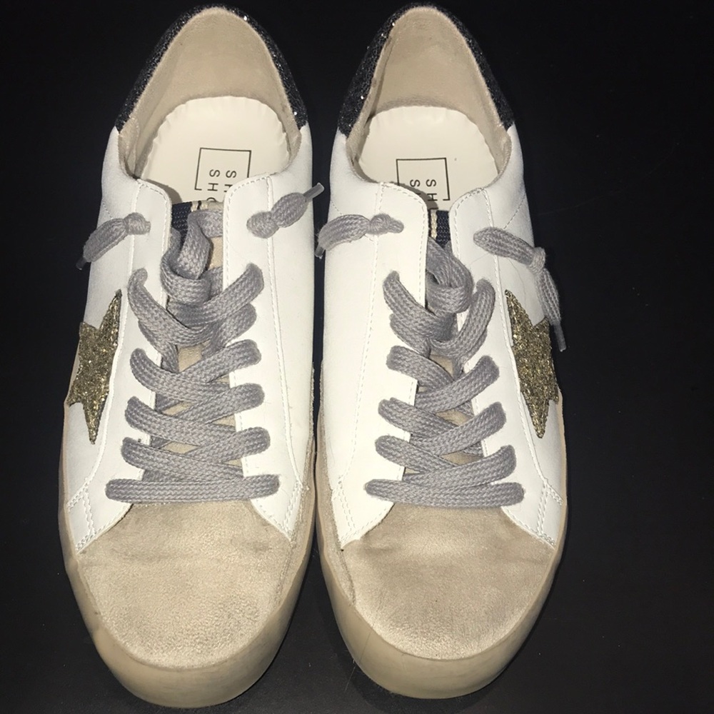 Barely worn Shu Shop shoe with a glittery gold star